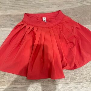 Bright coral Lululemon skirt built-in shorts